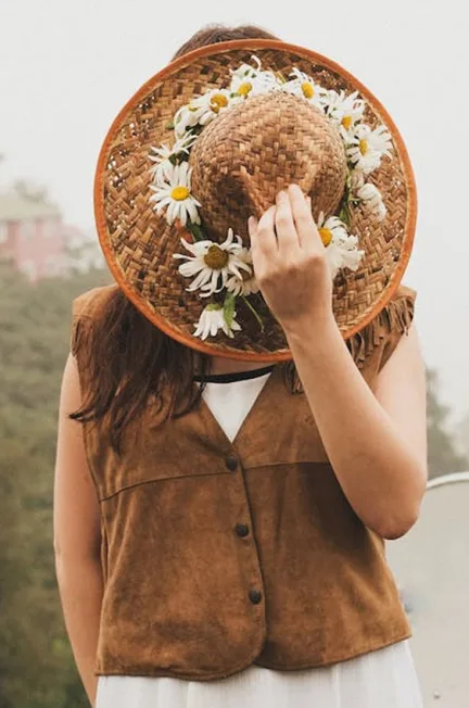 Women-in-brown-jacket-with-hat-hiding-face