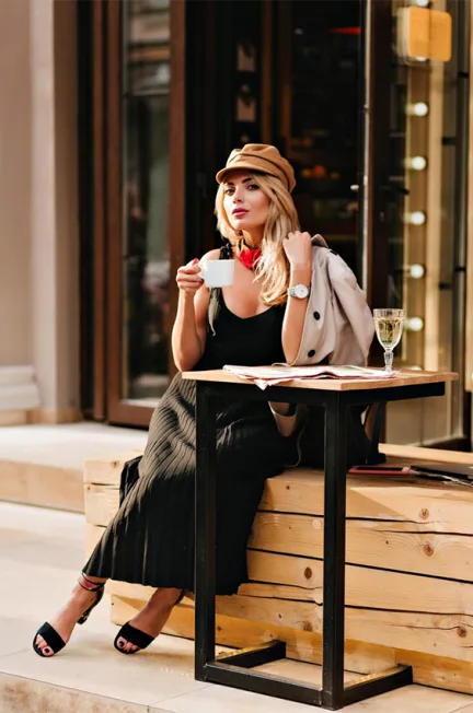 woman sitting on wooden bench