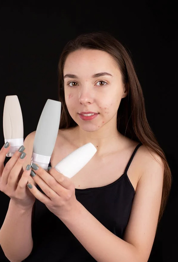 girl-holding-three-creams-in-hand