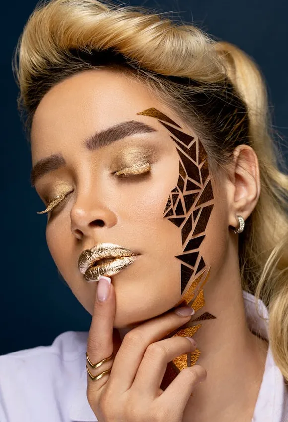 Woman in golden glitter makeup