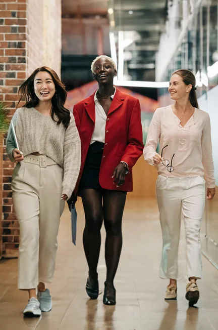 3 women walking happily