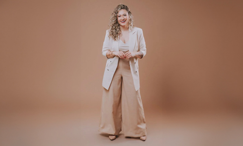 Women in white palazzo and beige pants