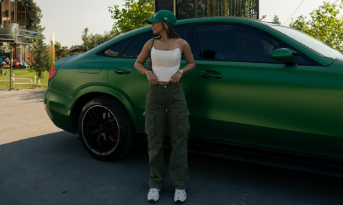 Women wearing green cargo pants and cap