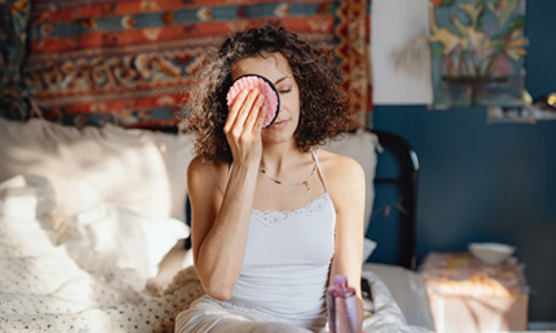 Woman removing her makeup