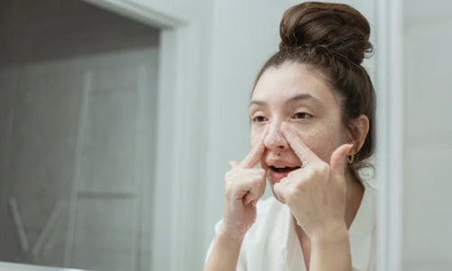 Women touching her nose