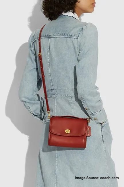 women wearing coach bag